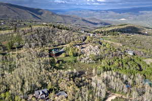Aerial overview of property's location with a mountainous background