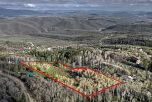 View of property location with property parcel outlined and mountains