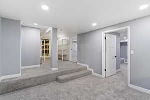 Below grade area with carpet flooring, recessed lighting, and baseboards