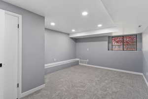 Below grade area featuring carpet flooring, baseboards, and recessed lighting