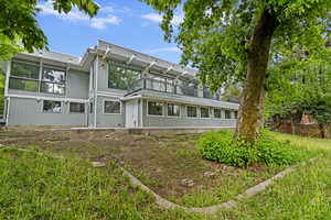Back of house featuring a balcony