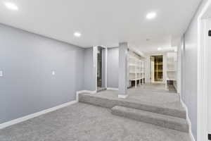 Basement featuring carpet, recessed lighting, and baseboards