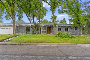 Mid-century home with stone siding