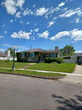 Ranch-style home with a front lawn and driveway