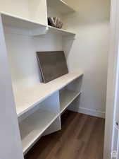 Mudroom with dark wood-style floors and baseboards