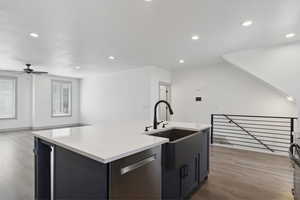 Kitchen with dishwasher, a sink, light wood-type flooring, ceiling fan, and recessed lighting