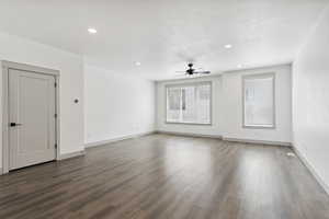 Unfurnished living room with ceiling fan, wood finished floors, baseboards, and recessed lighting