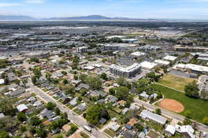 Aerial overview of property's location featuring a mountain backdrop