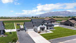 Aerial view of property and surrounding area with mountains