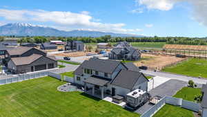 Aerial view of sparsely populated area with a mountain backdrop and nearby suburban area