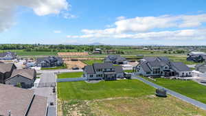 Aerial perspective of suburban area featuring a mountain backdrop