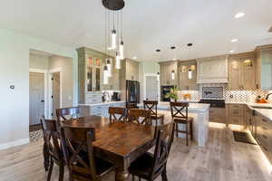 Dining area featuring light wood finished floors, recessed lighting, and baseboards