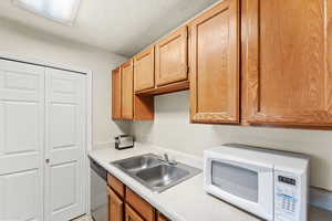 Kitchen area with pantry/laundry in background