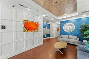 Secured modern lobby area, leads to elevators