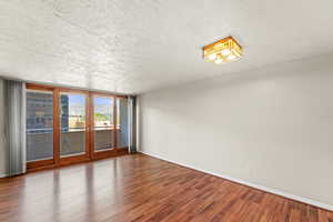 Living room with floor to ceiling windows, lots of natural light