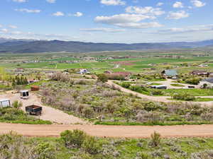 Overview of rural landscape with a mountain backdrop