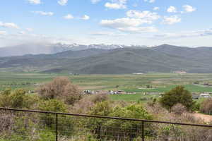 View of mountain background with rural landscape and agricultural land