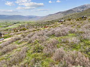 View of mountain backdrop featuring rural landscape