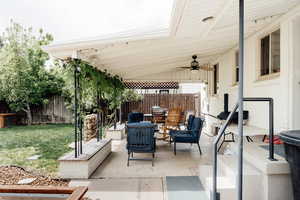 View of patio with a ceiling fan