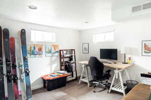 Office with carpet flooring and baseboards