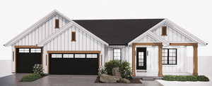 View of front of property with board and batten siding, concrete driveway, an attached garage, and roof with shingles