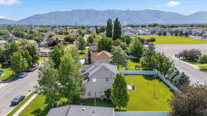 Aerial perspective of suburban area with a mountainous background