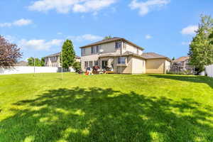 Rear view of property featuring stucco siding
