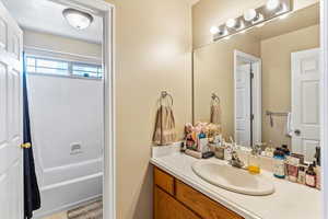 Full bath featuring vanity and tub / shower combination