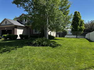 View of yard with a garage