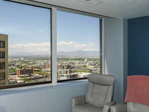 Sitting room featuring a city view and a mountain view