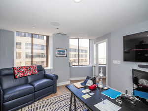 Home office featuring wood finished floors and baseboards