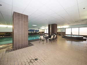 Common area with a paneled ceiling