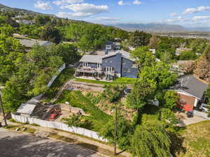 Aerial view of residential area featuring a mountainous background