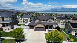 Aerial view of residential area featuring a water and mountain view