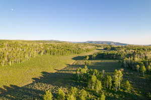 Aerial overview of property's location with a mountainous background