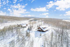 Snowy aerial view with a mountain view