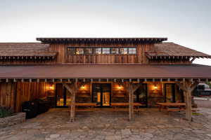 Rear view of property featuring a patio area and fence