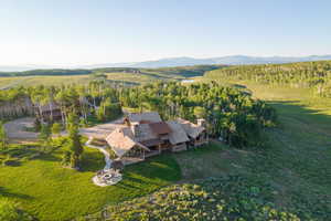Aerial view of property's location with a mountain backdrop