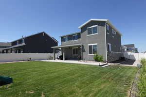 Rear view of property with a patio area and stucco siding