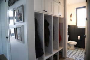 Mudroom with light floors and healthy amount of natural light