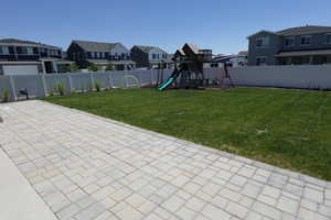 View of yard with a residential view, a playground, and a patio area