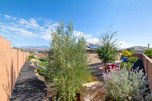 Fenced backyard with a mountain view
