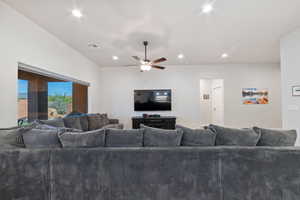 Living area with a ceiling fan and recessed lighting