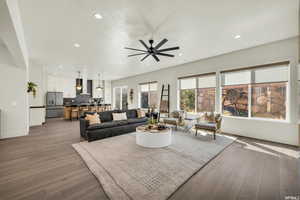 Living area with ceiling fan, recessed lighting, wood finished floors, and baseboards