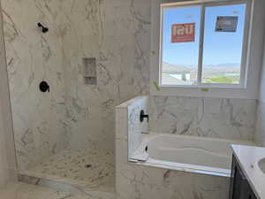 Full bathroom featuring vanity, a bath, a marble finish shower, and marble finish floors