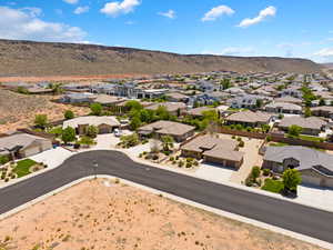 Aerial view of residential area featuring a mountainous background