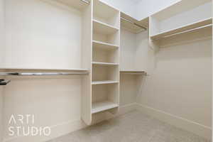 Spacious closet with carpet floors