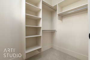 Spacious closet featuring carpet