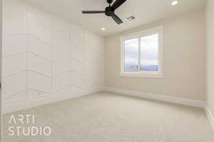 Empty room featuring carpet floors, ceiling fan, baseboards, and recessed lighting