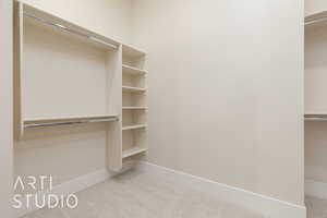 Spacious closet with carpet